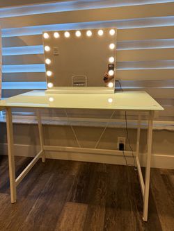 Desk used as vanity with LED mirror