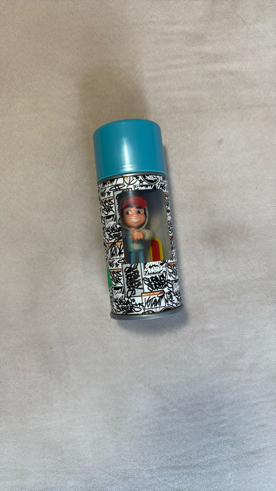 This is a Subway Surfers Sub Surf Spray Crew toy figure of the character Jake, inside a spray can-shaped container