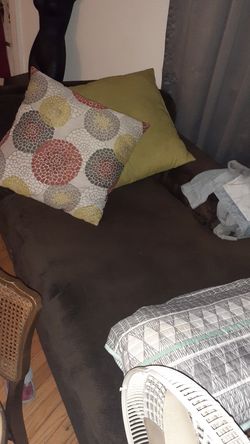 Big lounge brown couch with pillows