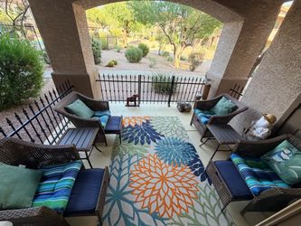 Four chair patio set with foot stools