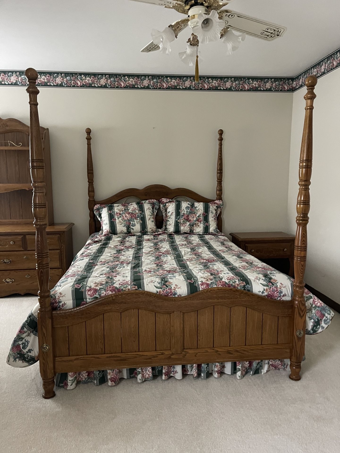 Vintage bedroom set – poster bed, dresser, freestanding mirror, and nightstand.