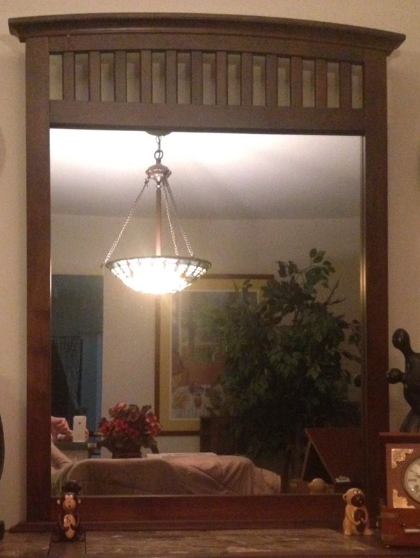 Mirror with brown wooden frame