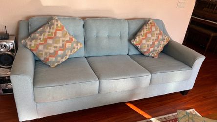 2 teal couches