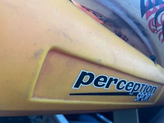 Perception Sport Rambler 13.5 Tandem Kayak (the red and yellow sit-on-top model),