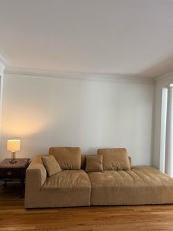 Large Tan Sectional Sofa with Cushions
