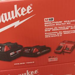 Milwaukee 5.0ah And 2.0ah Batteries And Charger