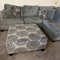 Gray L shaped sectional with ottoman