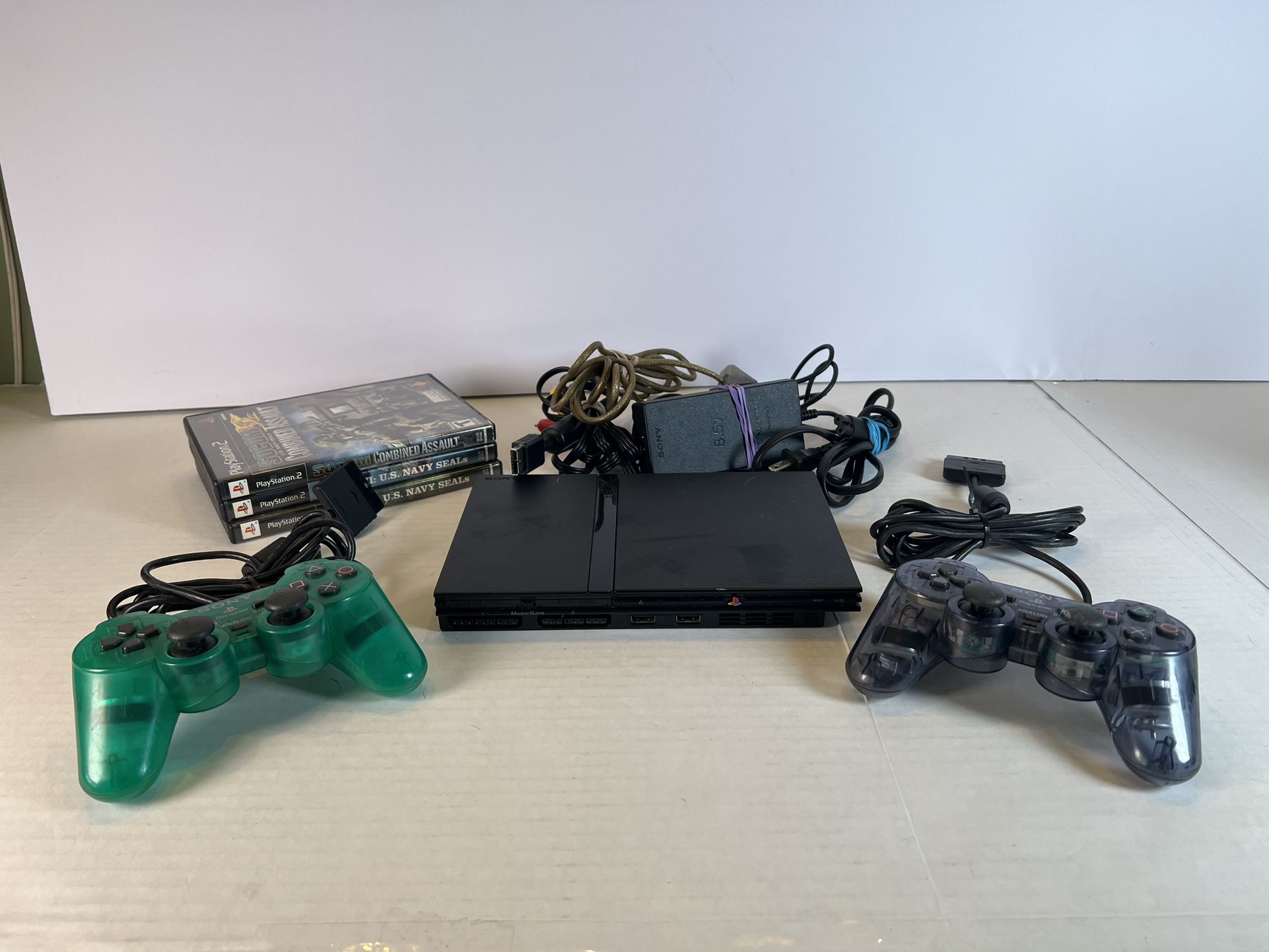 Sony PlayStation 2 (PS2) Slim Lot With 3 Games And 2 Controllers