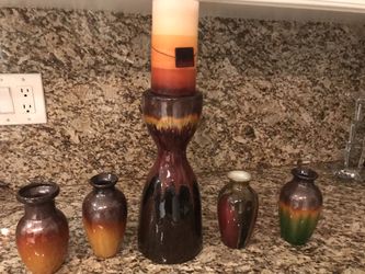 Pillar candle holder with vases. Like new.
