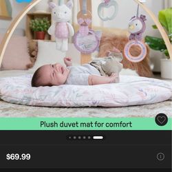 Ingenuity activity gym with wooden toy bar