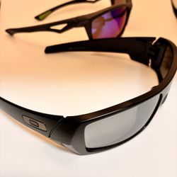 2 Pairs Of Polarized Sunglasses, Oakley And A Generic China Brand But Still Good For The Polarization Lenses That’s Used For Fishing Or Outdoor Sports