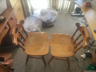 2 wooden swivel chairs