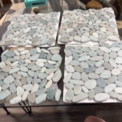 All for 12.00—4 tiles-pebble tiles on mesh backing for floors, window sills