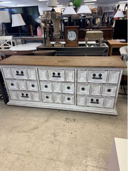 farmhouse-style dresser features a distressed white finish with a dark wood top -70” x 18” x 30” - Excellent Condition