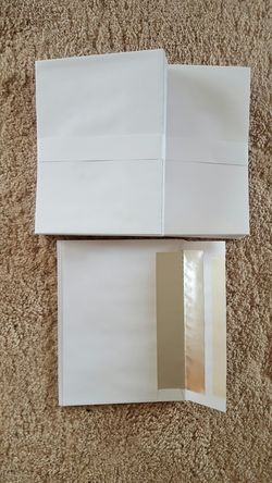 63 white envelopes (6x8)