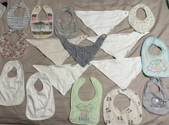 Baby bibs - about 20 of them - majority of them are never used