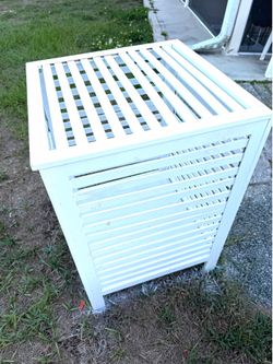 Large wood slatted cabinet has variety of uses