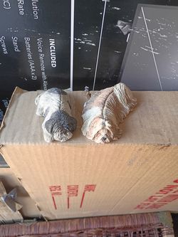 Two shitzu figures