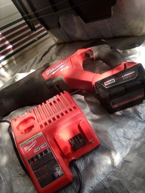 Milwaukee Sawzaw And Charger Plus Battery