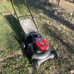 Craftsman walk-behind lawn mower. It is powered by a Briggs & Stratton engine
