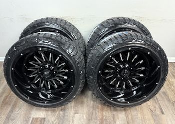 New 22x12 gloss black wheels wrapped in RBP 285/45r22 tires