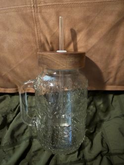 Glass cup with straw