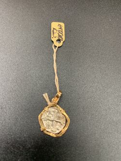 Atocha silver coin pendant in gold bezel