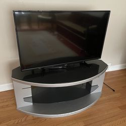 Tv Stand  L 50”  H  20” W 28”   Material: Solid wood and glass (It is heavy) 