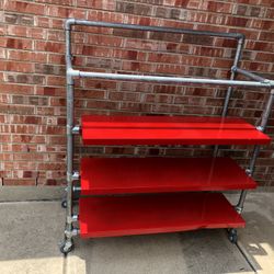 2 Commercial Rolling Clothes Rack With Red Metal Shelves From Well Know Store.
