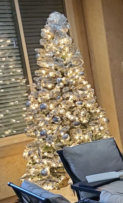 Beautiful Lighted And Flocked Artificial Christmas Tree