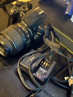 Nikon D5000 with lens and battery charger