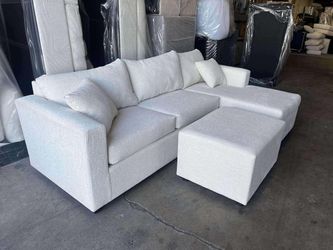 Brand new cream sectionals with free ottoman
