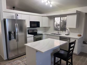 White shaker cabinets and white countertop