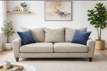 Gray Comfortable Sofa With 2 Blue Pillows
