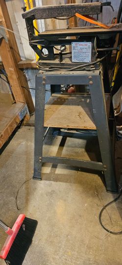 FREE Scroll saw stand. With saw, which needs work, but the motors works.