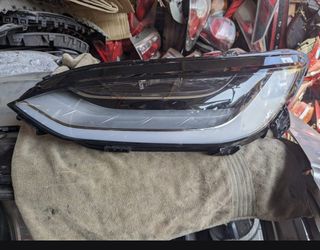 Tesla model x left side headlight it fits a 2021-2024