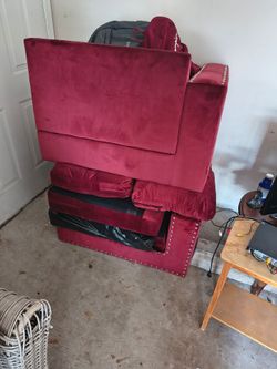 Disassembled sway red love seat.