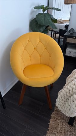 Yellow, suede swivel chair