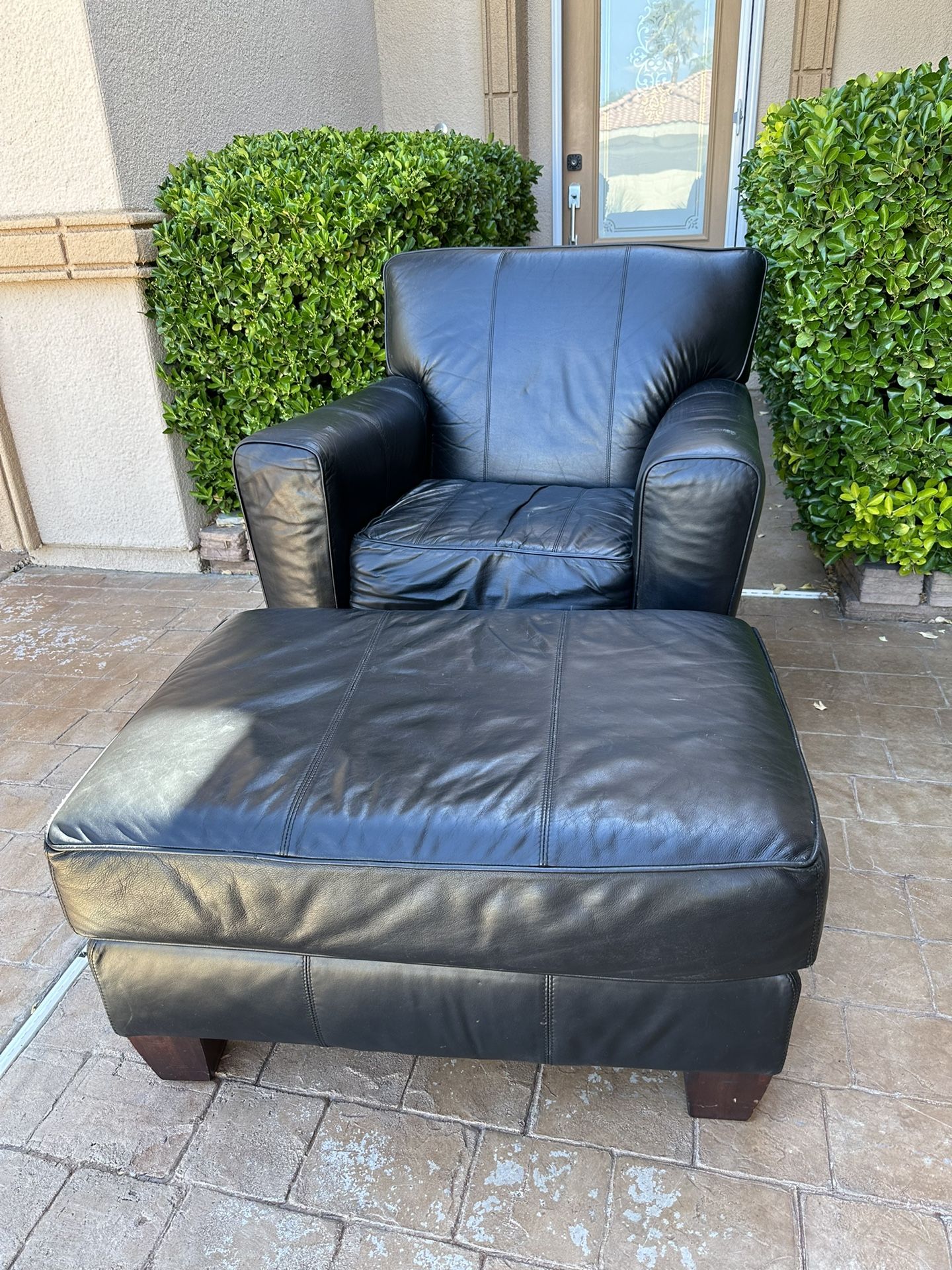 Black Leather Armchair & Ottoman 