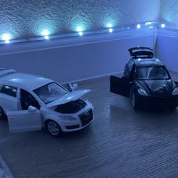 2 Di Cast Cars One Audi Q7 And a Porsche Cayenne S both For 25$  