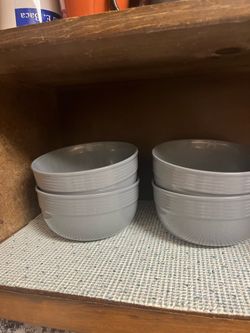 Assorted plates and glasses and other kitchen items.