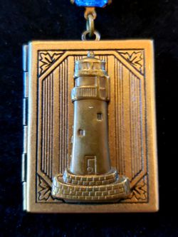 $15. Vintage Lighthouse Book Locket on Sterling Silver chain with ocean blue square glass rhinestone.