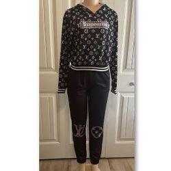 Women's set of sweatshirt with hat and pants .