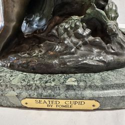 Seated Cupid By Fomile