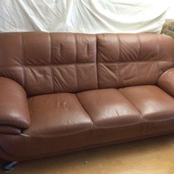 brown three seater leather couch