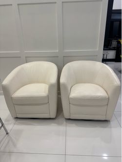 Pair of leather swivel chairs with   curved barrel back design - Excellent Condition