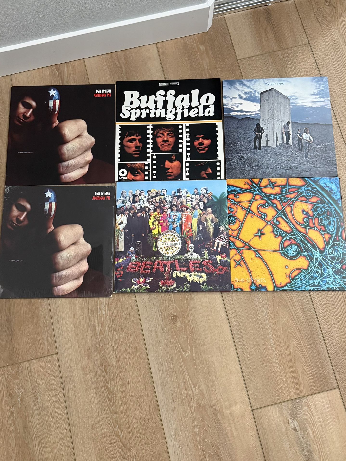 Audio Technica turntable with speakers and a set of vinyls