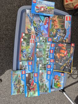 9 Lego set pieces and booklets