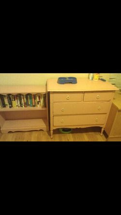 Pink antique dresser and bookcase