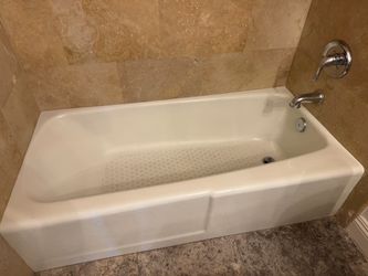 White Alcove Bathtub with Chrome Faucet